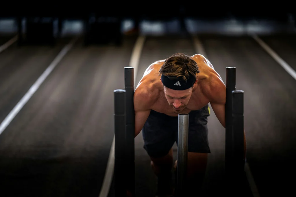 Athlete during Hyrox training sled push